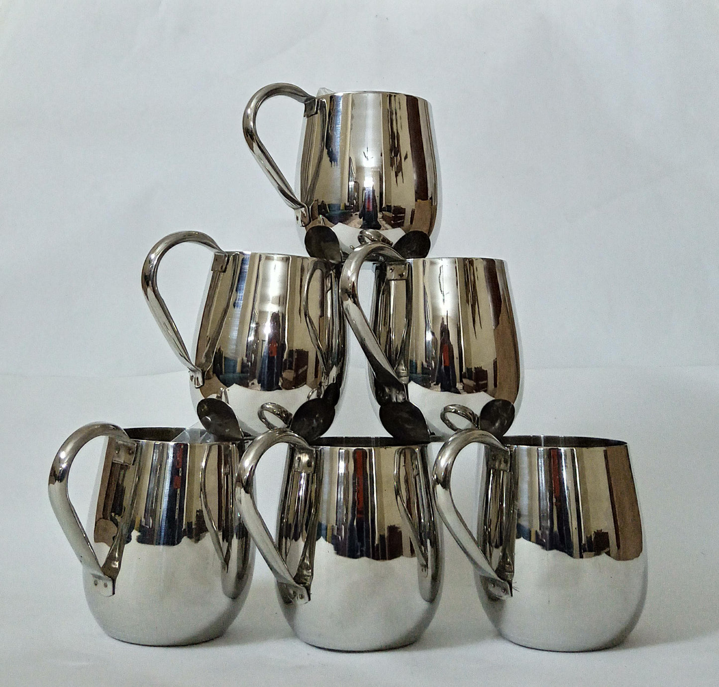 "Sip in Style: Elegant Silver Cup" Your Signature Handled Cup