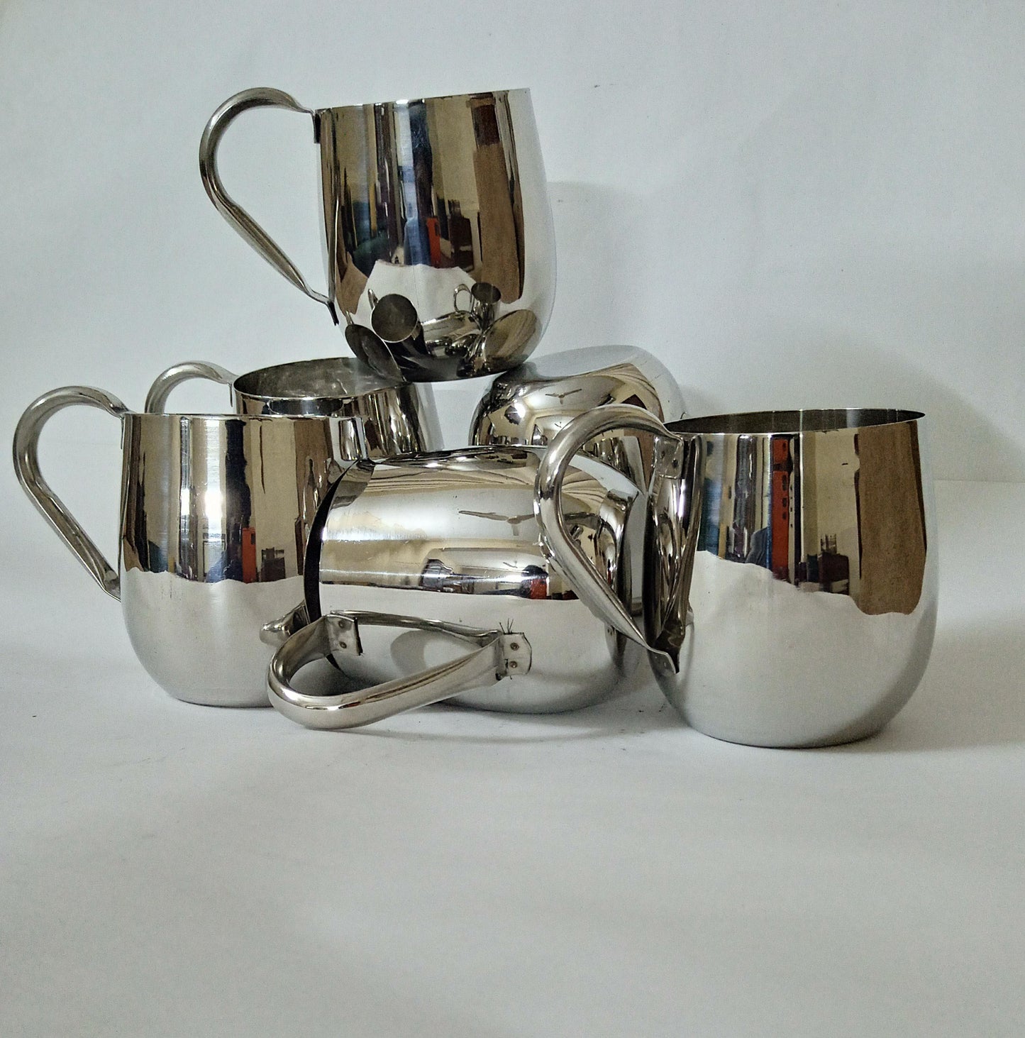 "Sip in Style: Elegant Silver Cup" Your Signature Handled Cup