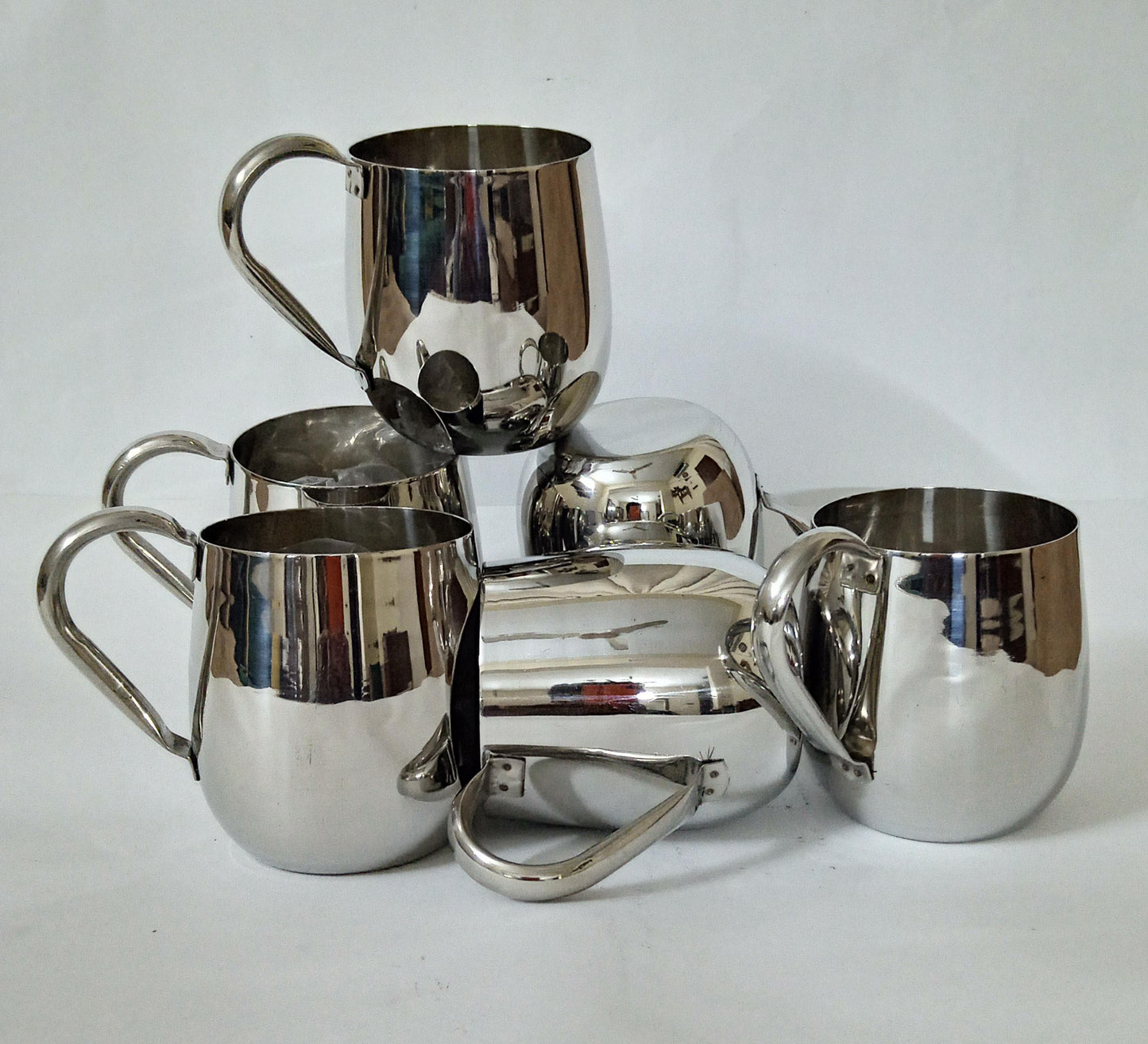 "Sip in Style: Elegant Silver Cup" Your Signature Handled Cup