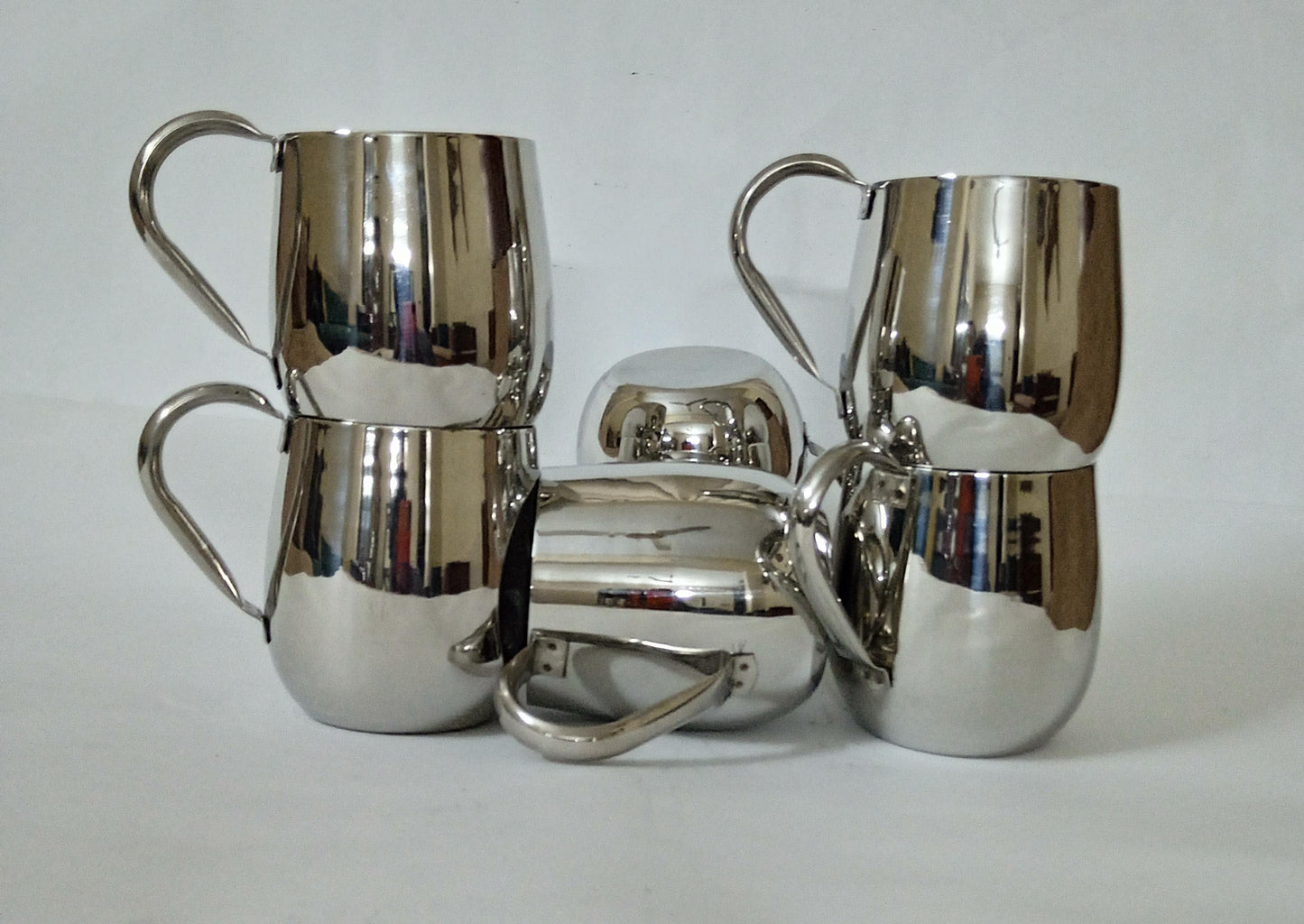 "Sip in Style: Elegant Silver Cup" Your Signature Handled Cup