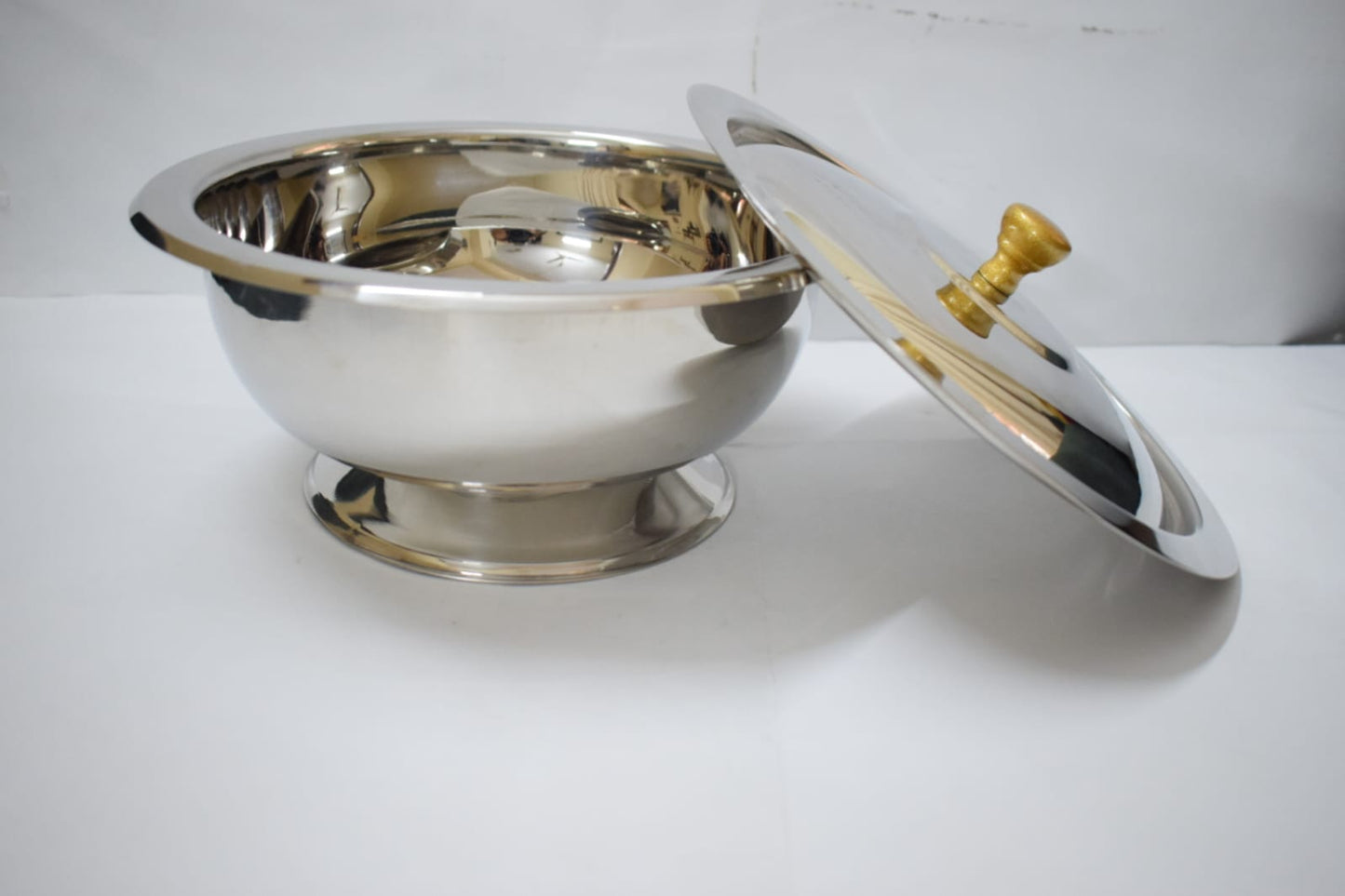 Salan Saver stainless steel serving bowl front angle with lid leaning